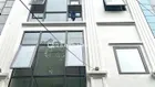 Tôi cần bán tòa nhà 7 tầng thang máy gồm 5 PN khép kín. DT 50m2, cách Hồ Tây 30m. Ô tô đỗ gần nhà